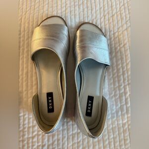 Women's size 10 DKNY peep-toe in metallic silver.